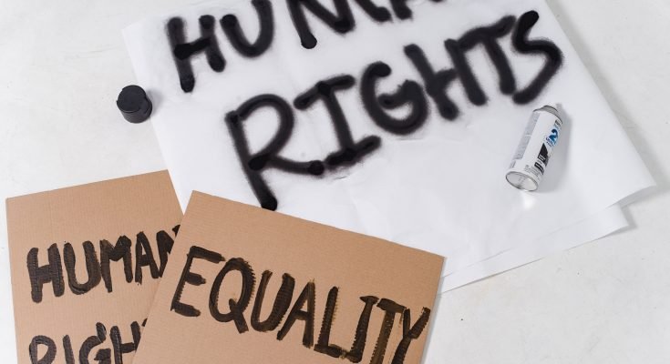 The Text Human Rights and Equality on Cardboard Placards