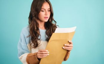 Woman holding a brown envelope