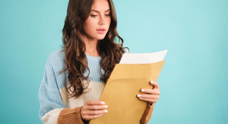 Woman holding a brown envelope