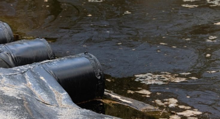 Polluted water leaking into a river