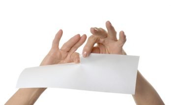 Person tearing up paper